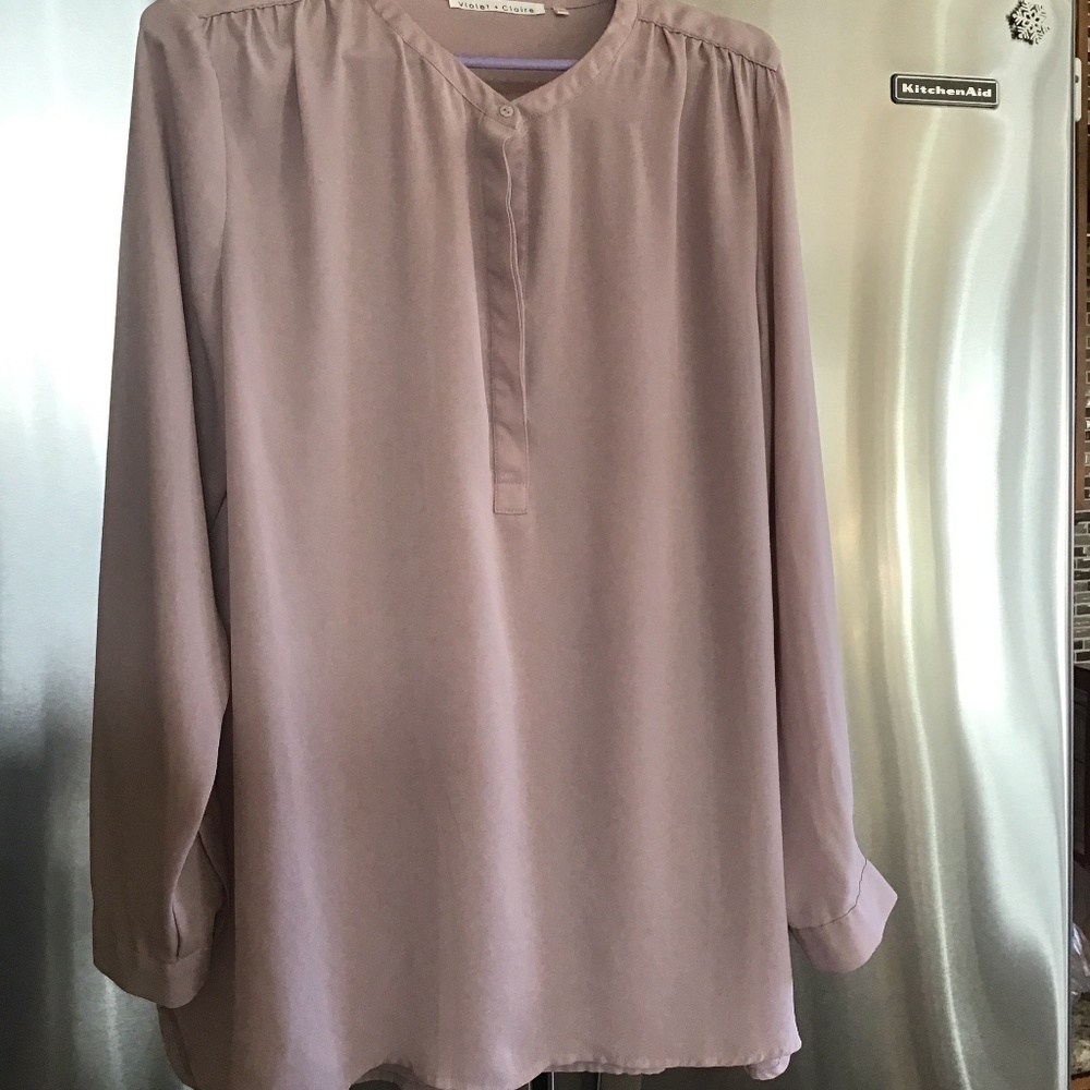 Woman’s sheer dusty pink blouse